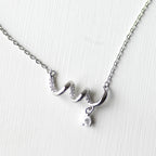The Spiral Ribbon & Teardrop Pendant