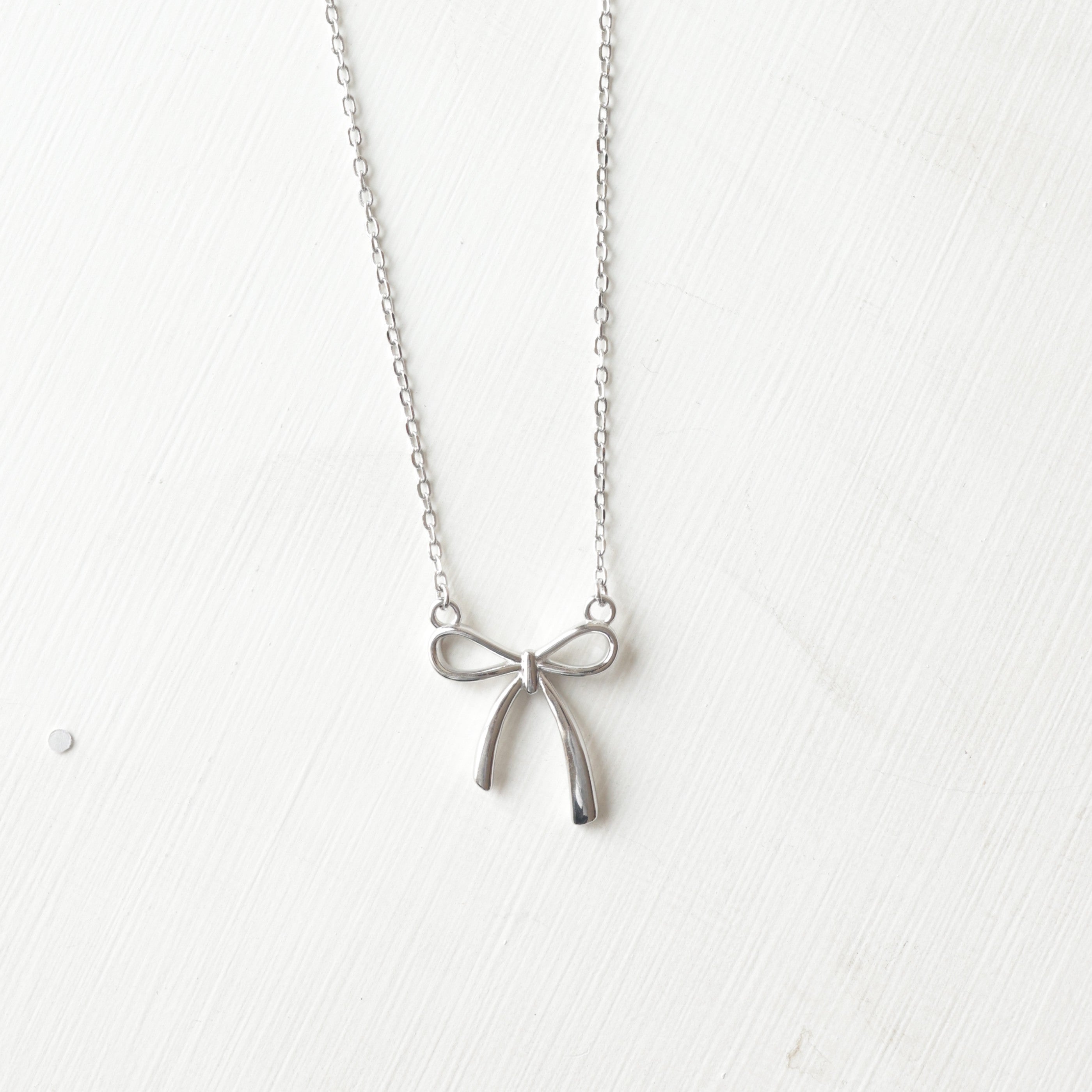 The Vega Silver Ribbon Bow Necklace